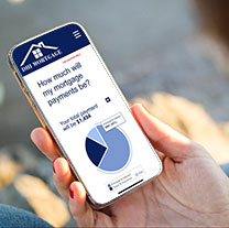 Phone held in hand. DHIMortgage.com Mortgage Calculator webpage open on phone.